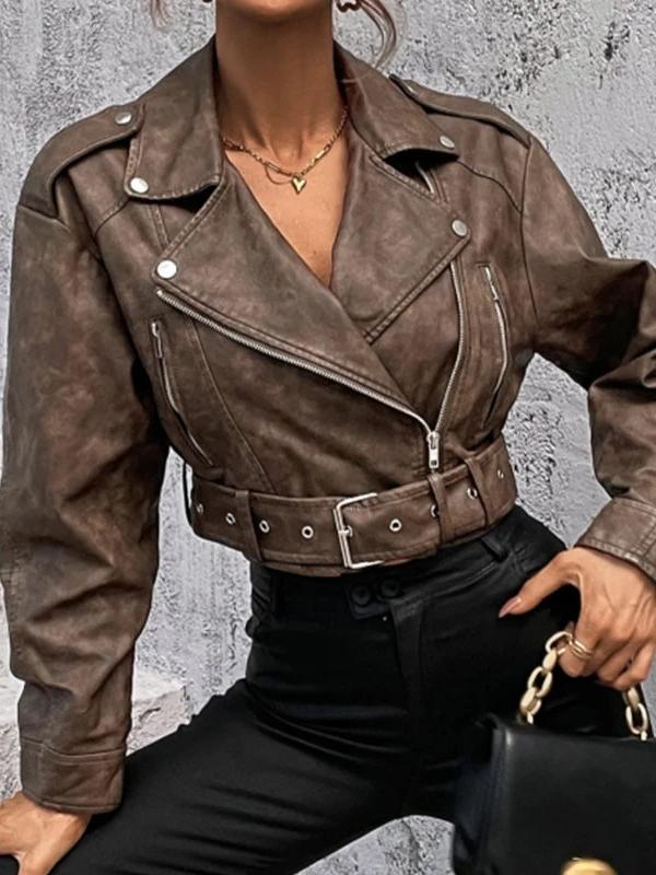 Brown PU leather moto jacket with wide lapels, silver zippers, belted waist, and epaulets, worn with black pants.