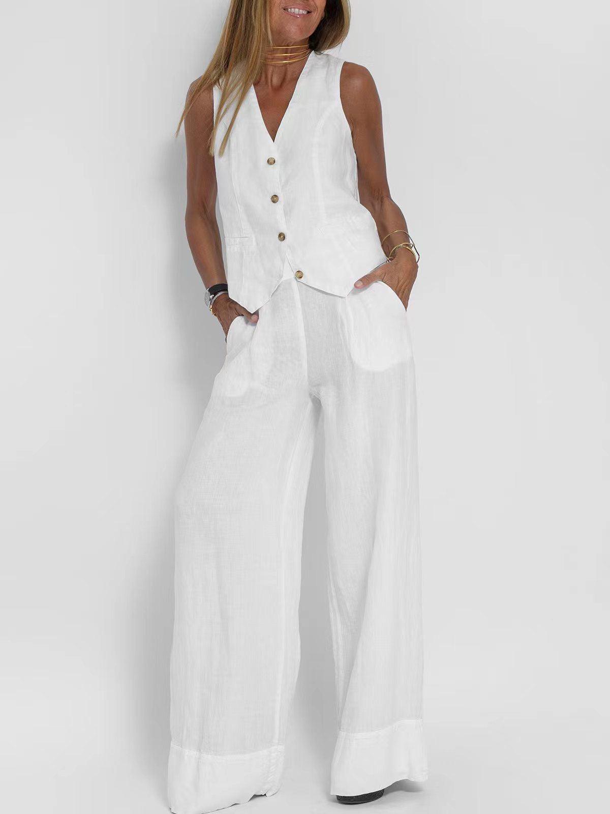 Woman wearing a white linen waistcoat with brown front buttons and matching wide-leg pants, sleeveless V-neck, pockets.