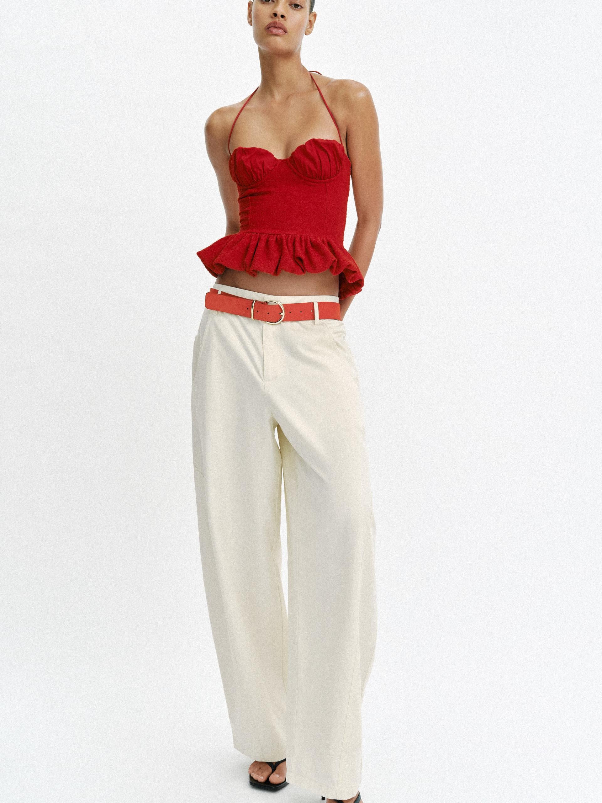 Rosette Halter Peplum Corset Top in red by EXCLUSIVES, halter neckline with peplum waist.