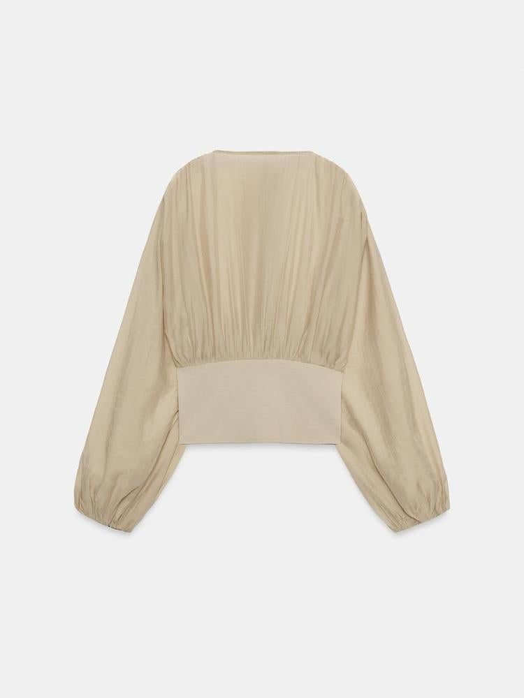 Plunge Neck Balloon Sleeve Top by EXCLUSIVES, beige satin blouse with cropped waist and voluminous sleeves.