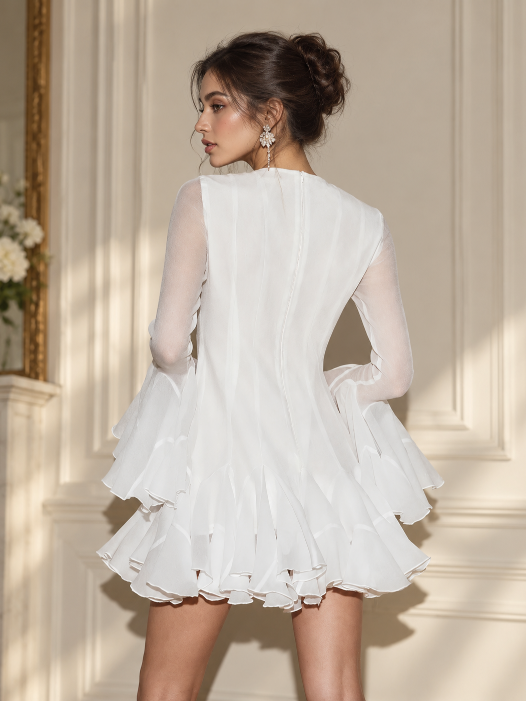 Elodie Blush Mini Dress by EXCLUSIVES, white dress with sheer long sleeves and tiered ruffled mini skirt.