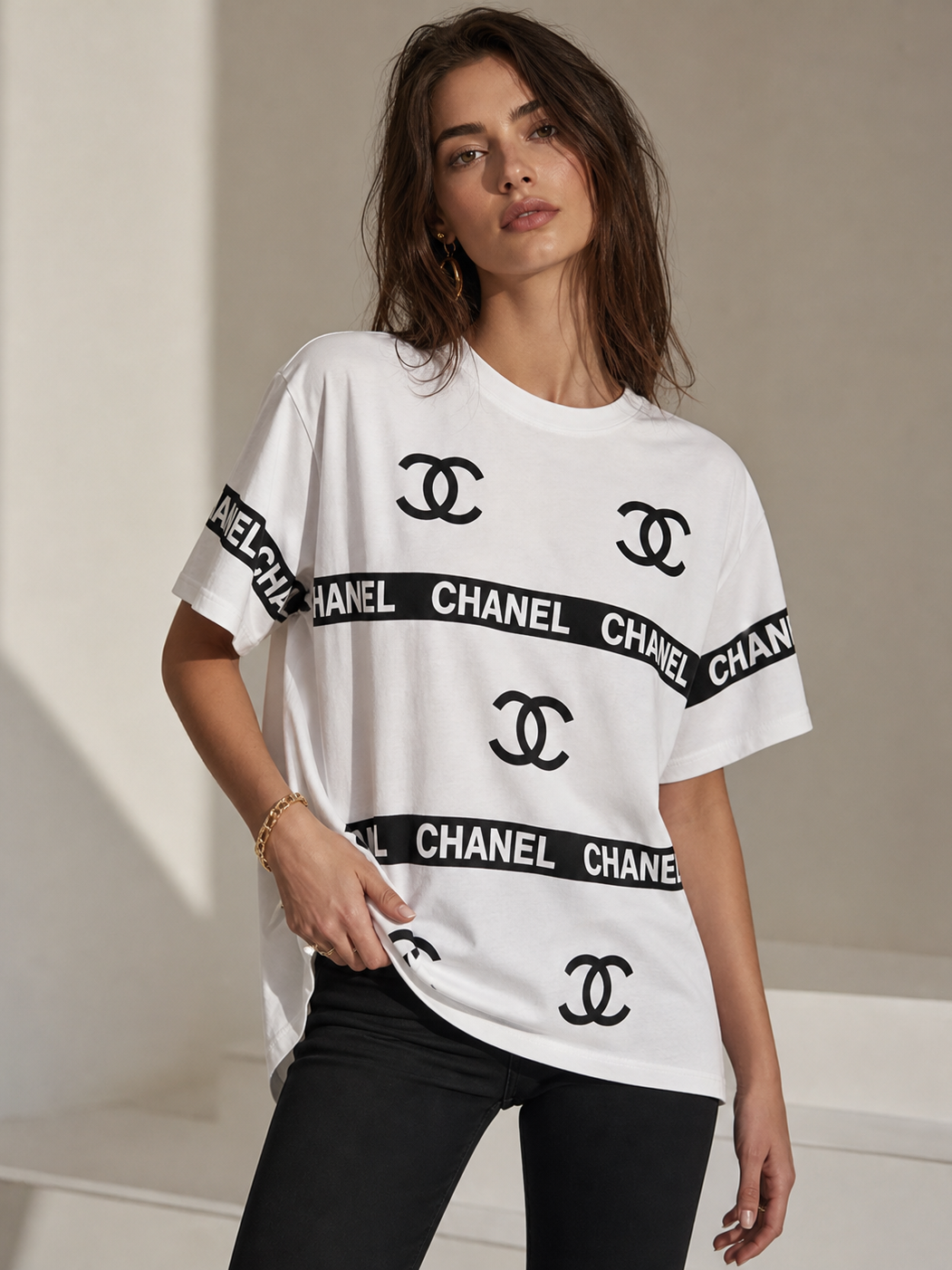 Print Cotton Lycra CH T-Shirt, white oversized top with black Chanel logos and CHANEL band across chest