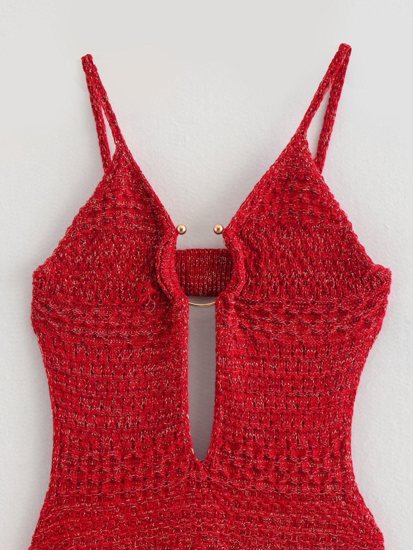 Red knitted backless dress with thin spaghetti straps, center front cutout, and small gold ring detail.