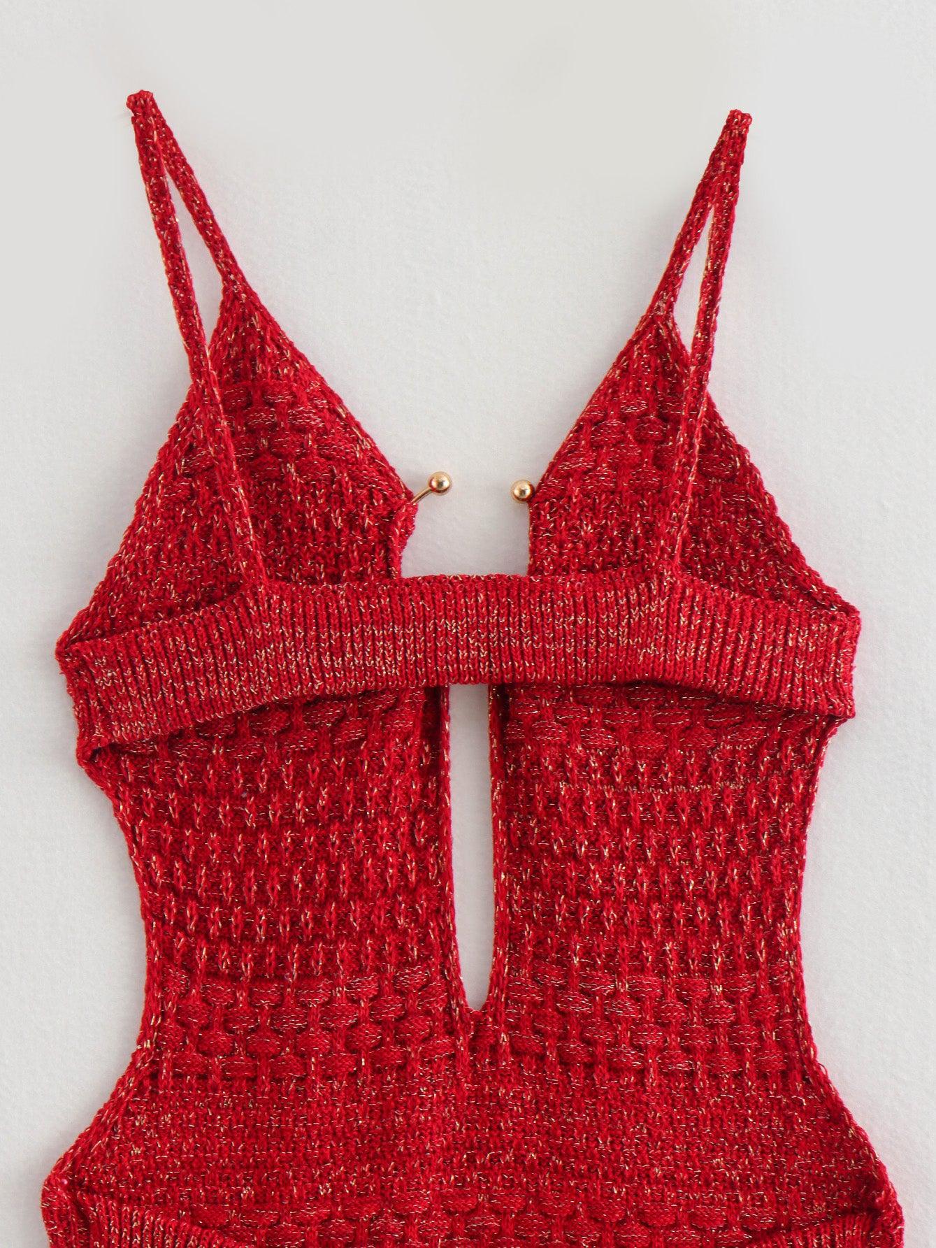 Red knitted backless dress with thin spaghetti straps, a wide ribbed band across the bust, and small gold ball accents.