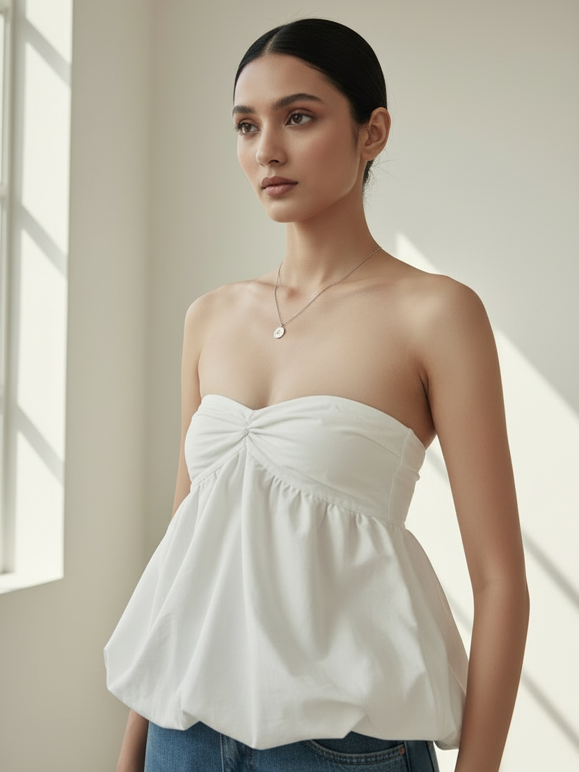 Ruched Ruffled Tube Top by Exclusives in white, strapless peplum-style top.