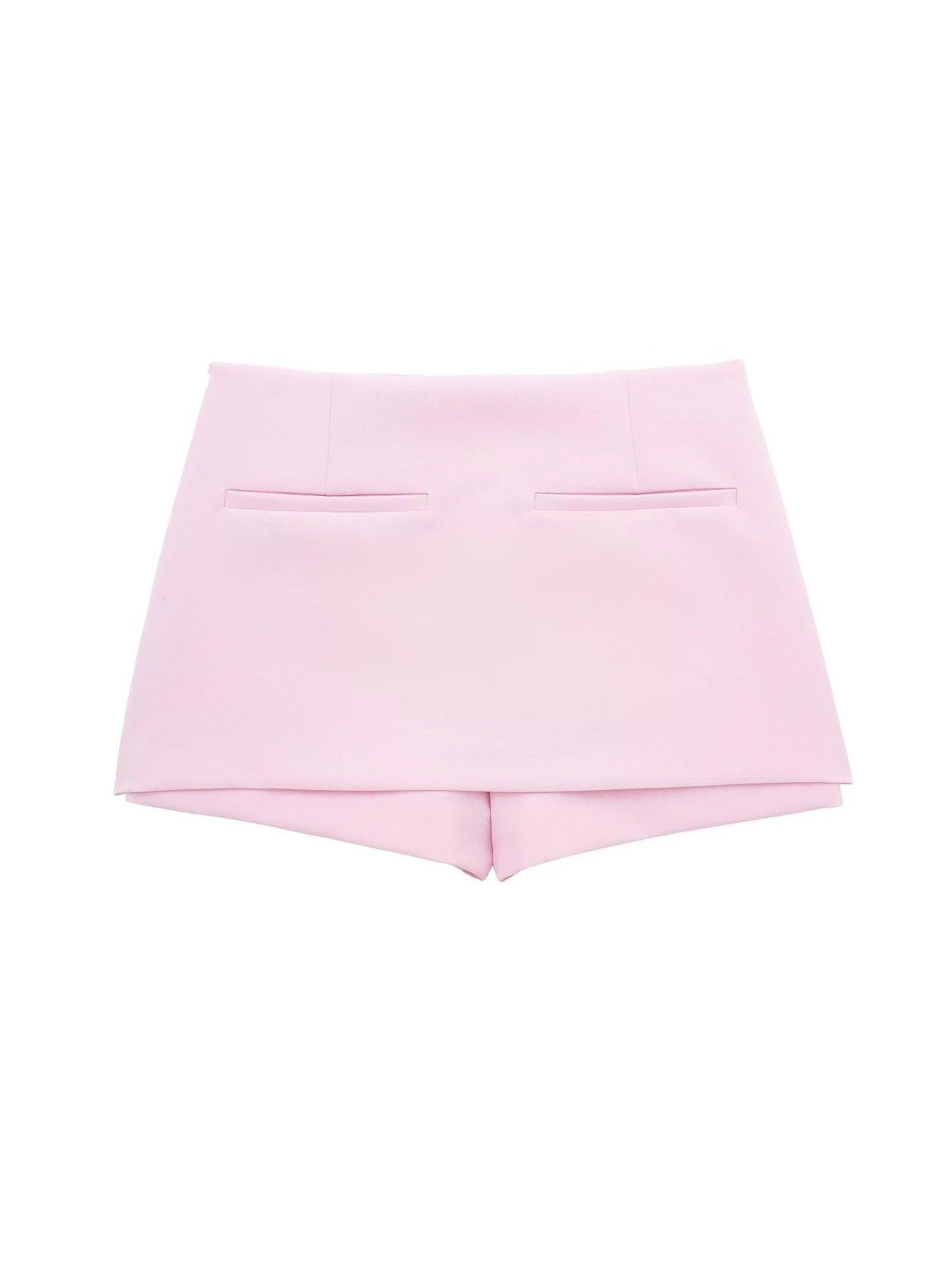 Back view of a pink halterneck waistcoat and matching pink skort set, showing two back welt pockets.