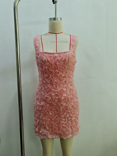 Pink mini dress densely covered in 3D rosettes, bodycon silhouette with square neckline and wide straps on dress form.