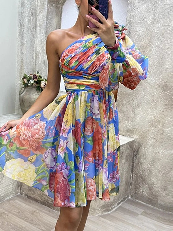 Vibrant floral print one-shoulder dress with a belted waist, long puff sleeve, and a pleated knee-length skirt.