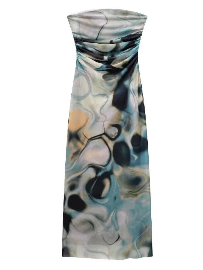 Strapless, floor-length tube dress with abstract beige, blue, and charcoal tie-dye patch print on tulle.