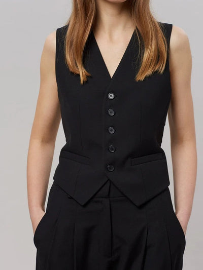 Black tailored sleeveless waistcoat with five buttons over matching high-waisted pants; V-neck, front peplum panels, side pockets.