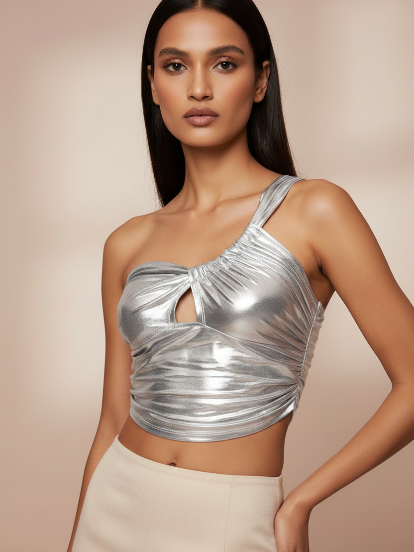 Top metallic silver one-shoulder crop top with front twist knot and ruched detail.