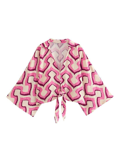 Pink and cream geometric printed bow-front shirt top with wide kimono sleeves and front tie.