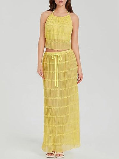Yellow halter crop top with layered ruffles and matching tiered maxi skirt; drawstring waist, light chiffon