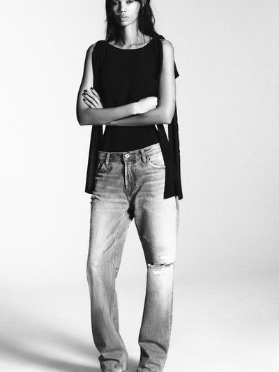City Sleek Black Bodysuit by SR Store, black sleeveless bodysuit worn with light denim jeans