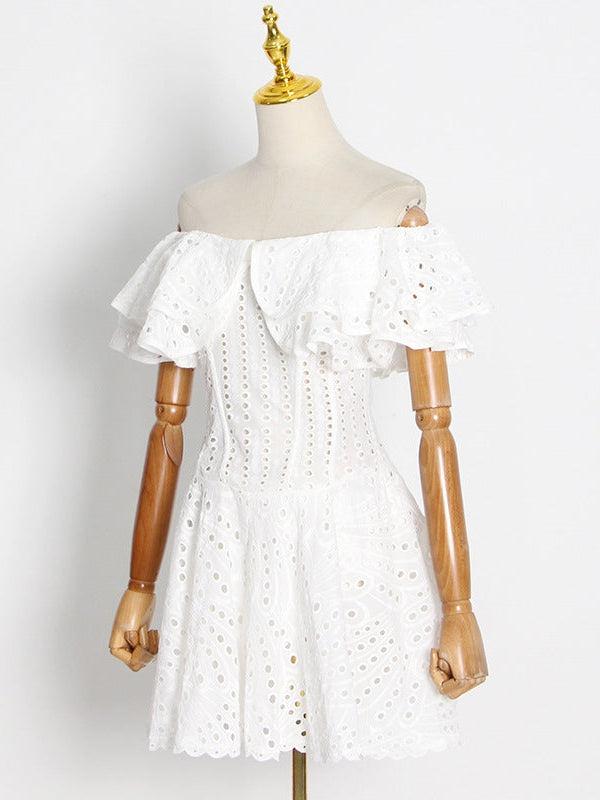 White off-shoulder eyelet dress on a mannequin with layered ruffle neckline and scalloped hem.