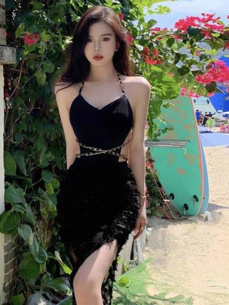 Noir Chain-Link Halter Monokini with Skirt swimsuit set in black with gold waist chain on model