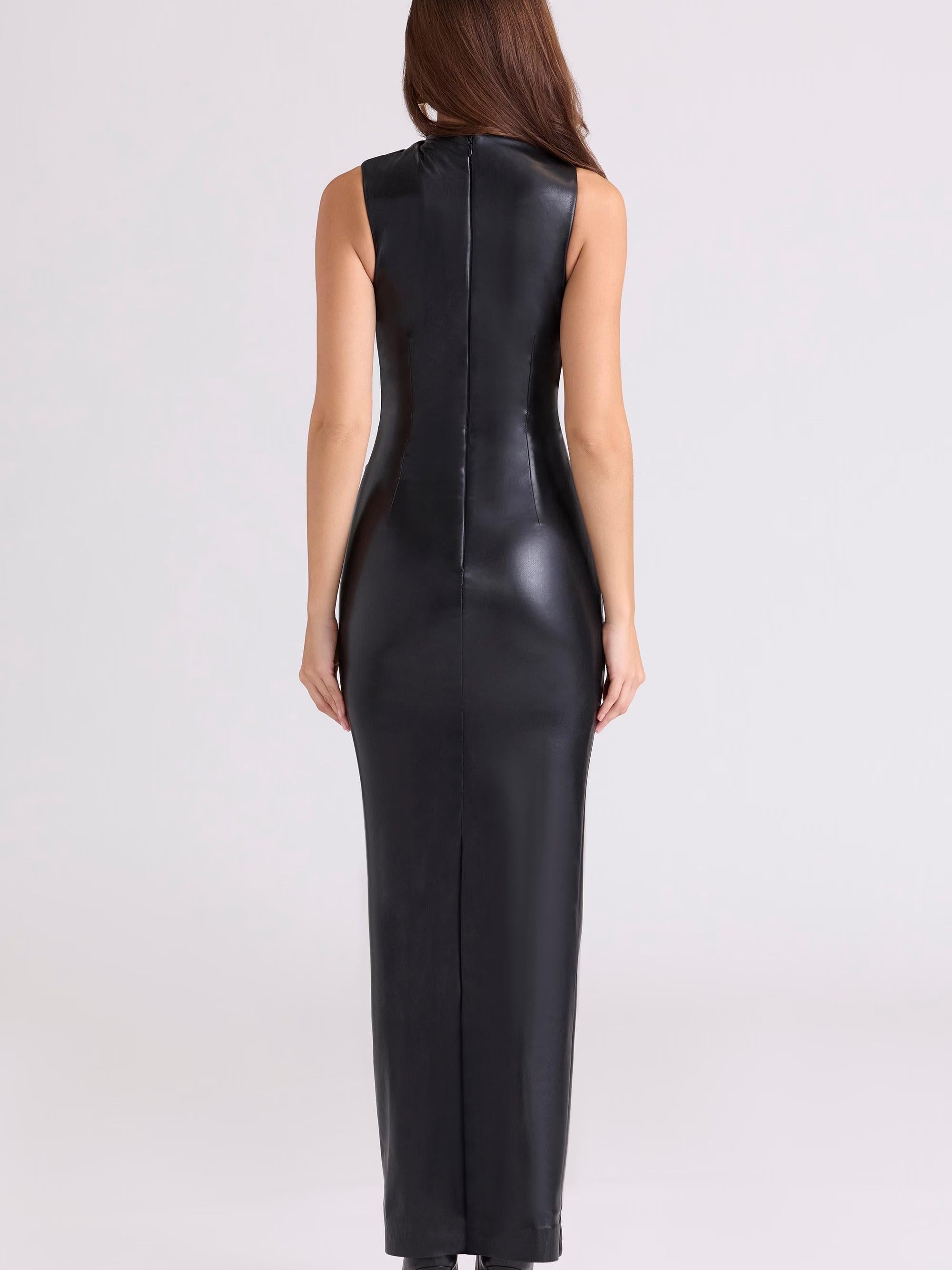 Back view of a woman in a black faux-leather sleeveless maxi dress with a center back seam and concealed zipper.