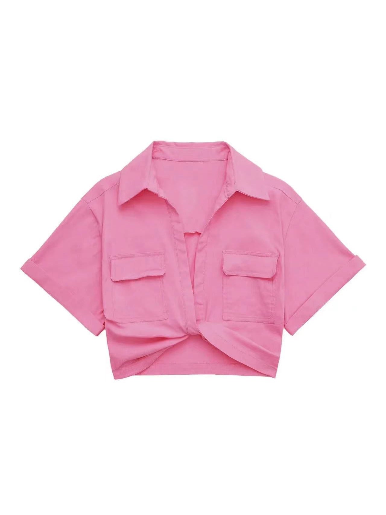 Pink linen crop shirt with a collar, short wide sleeves, two front chest pockets with flaps, and a front knot at hem.