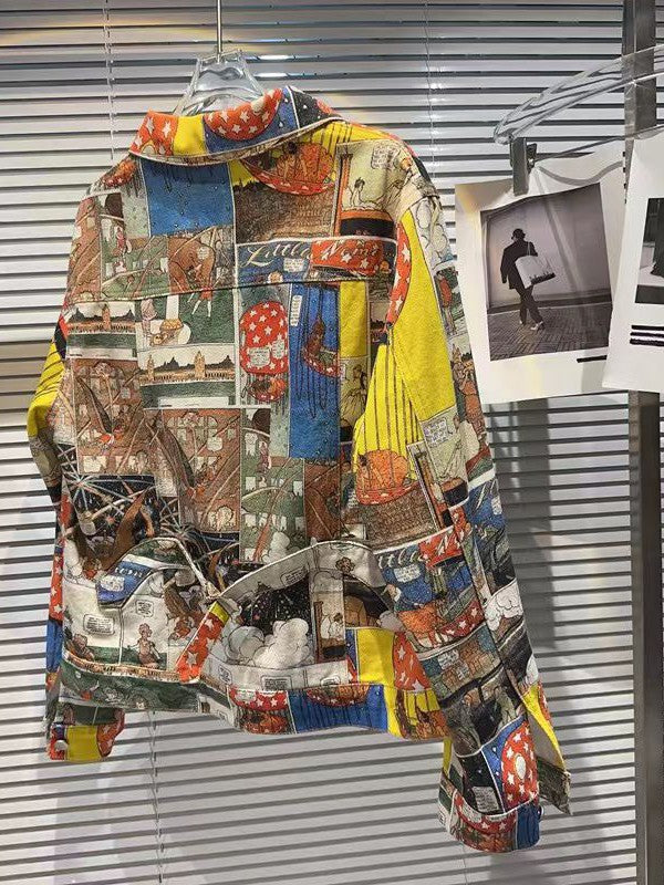 Brown patchwork printed denim jacket with multicolor collage panels hanging on a hanger.