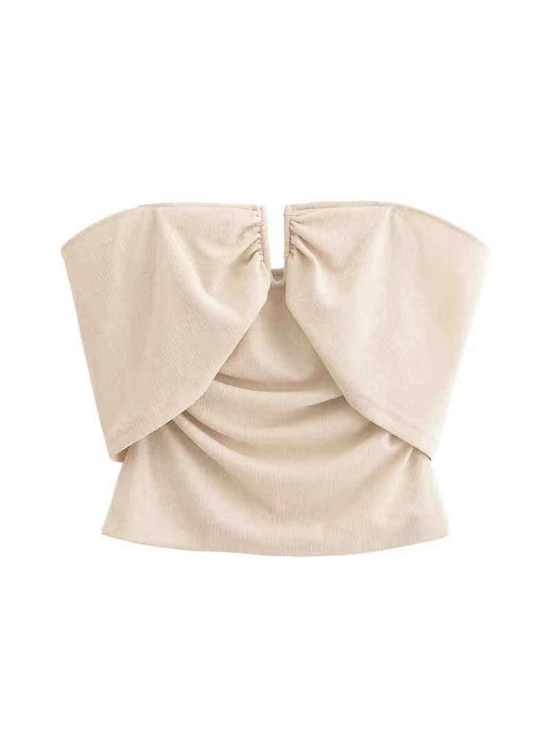 Beige off-shoulder tube top with a large front bow created by gathered, draped fabric.