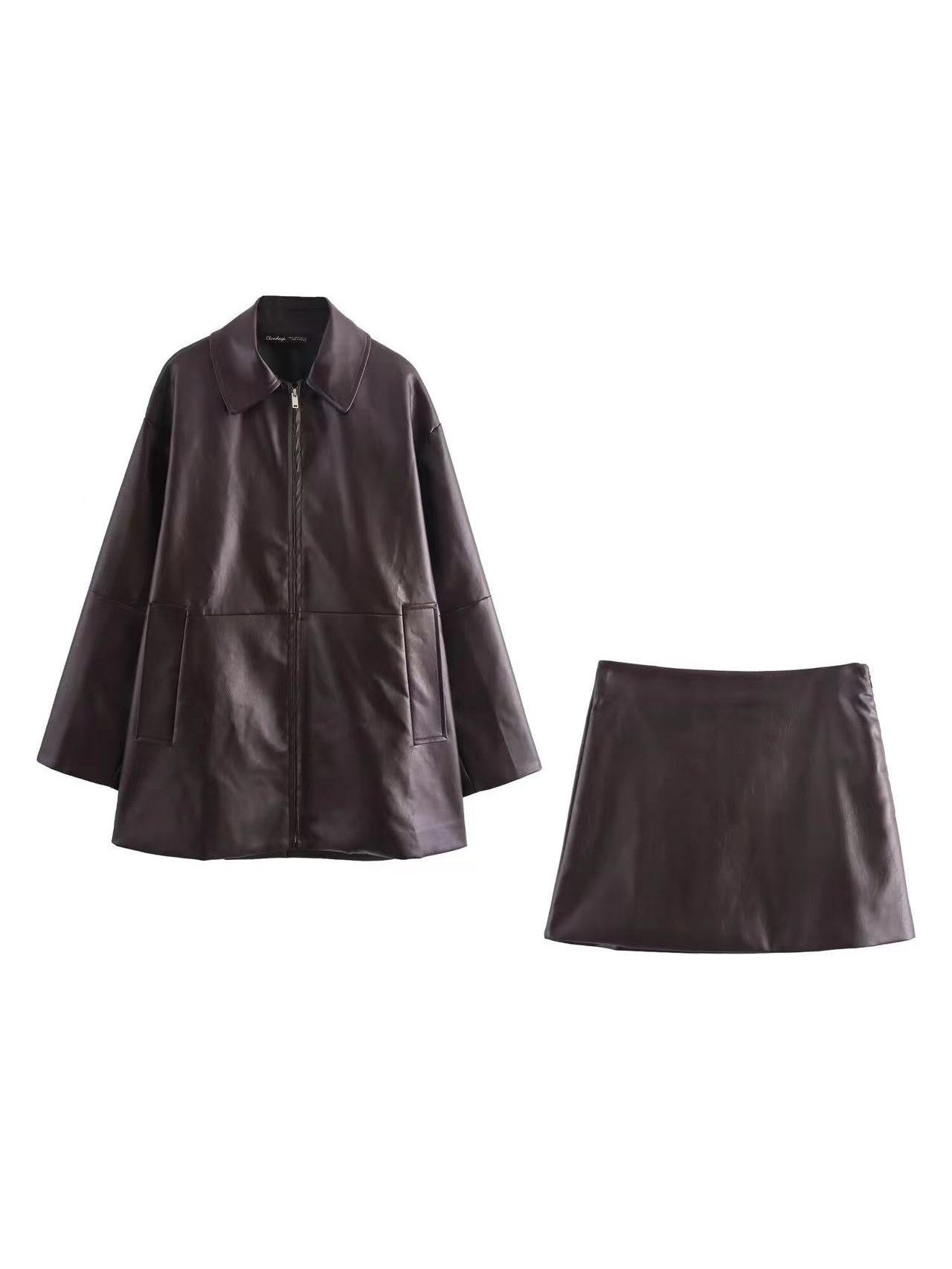 Dark brown leather long jacket with front zipper, collar, and large pockets, paired with a matching short leather skirt.