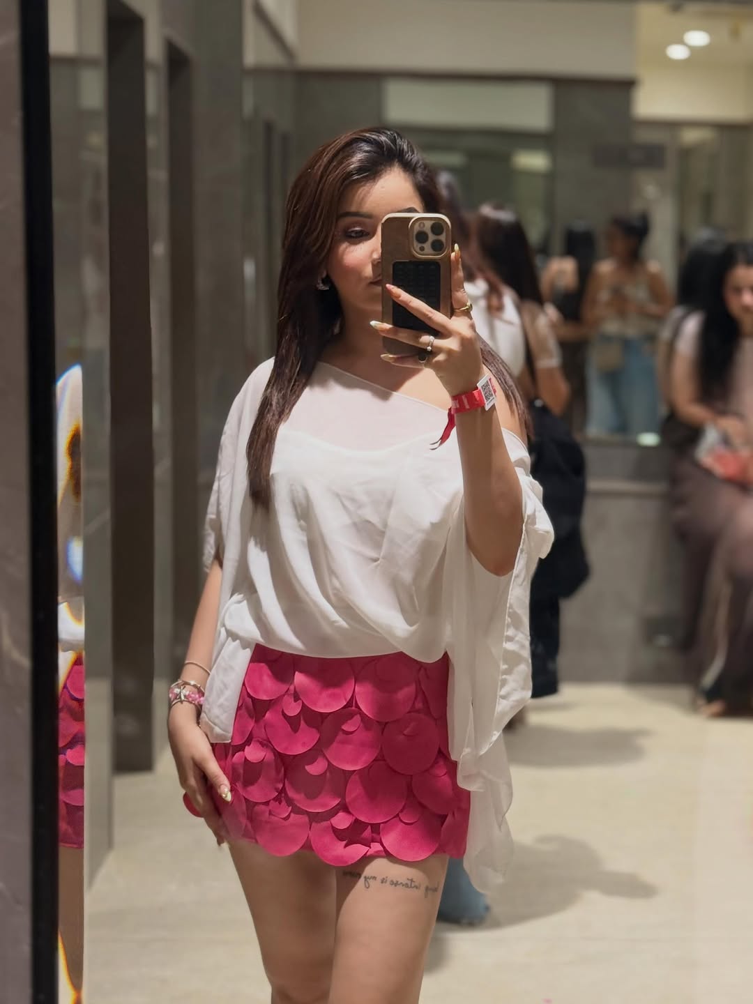 White Coin Mini Skirt in pink with circular coin-like texture