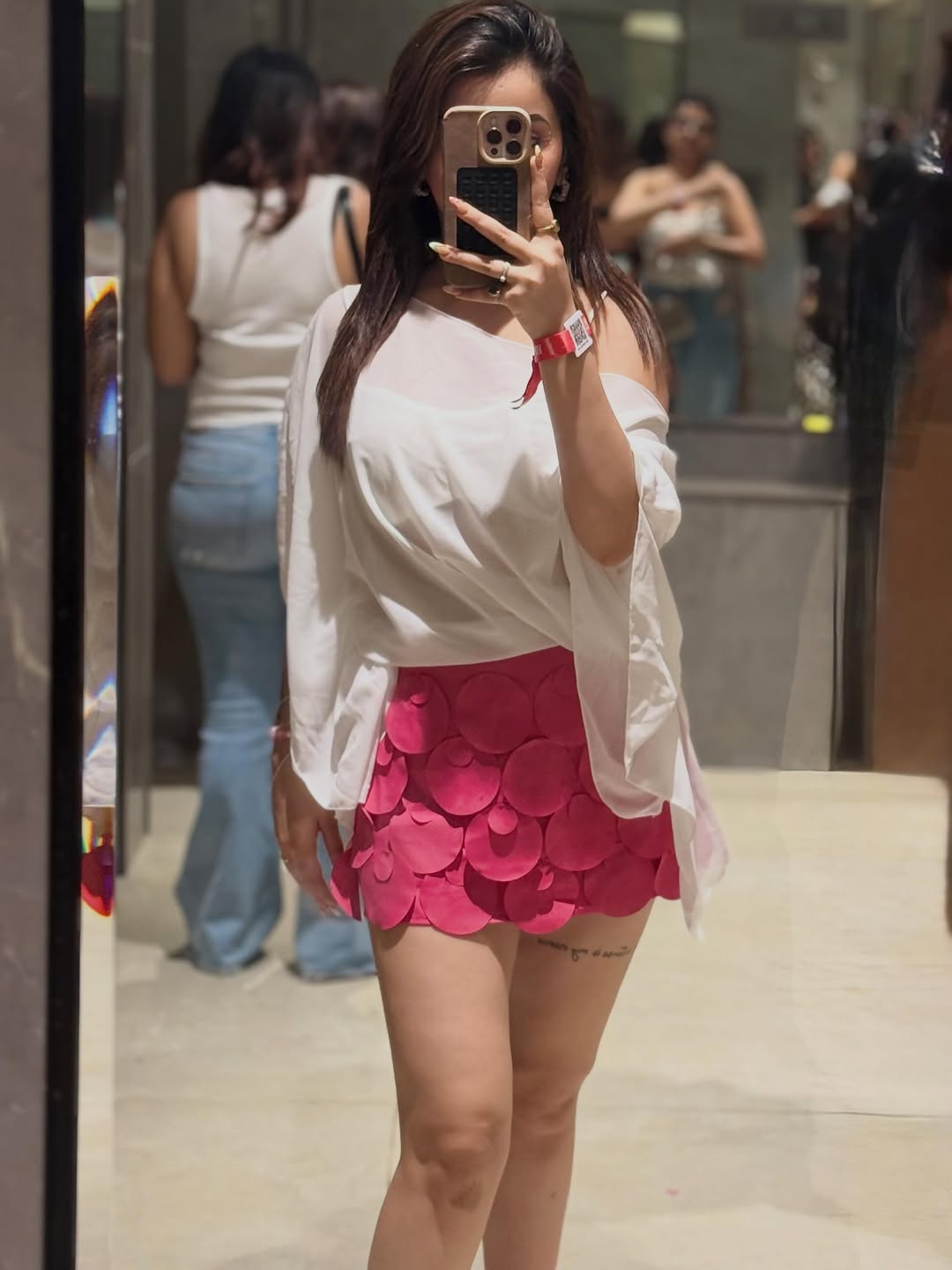White Coin Mini Skirt on sale by Exclusives; coin-disc mini skirt.