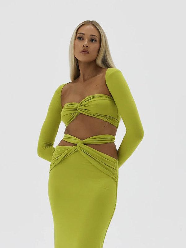 Bright lime green twist-front bandeau top with long sleeves and a matching high-waisted knotted wrap skirt