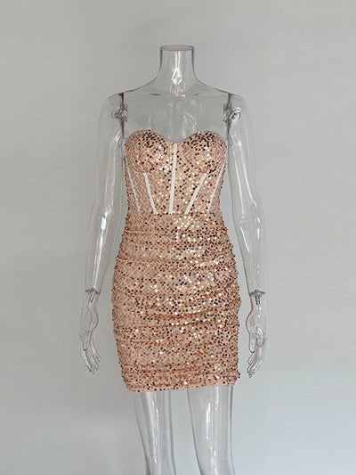 Champagne-pink sequin strapless corset mini dress with boned bodice on a clear mannequin.