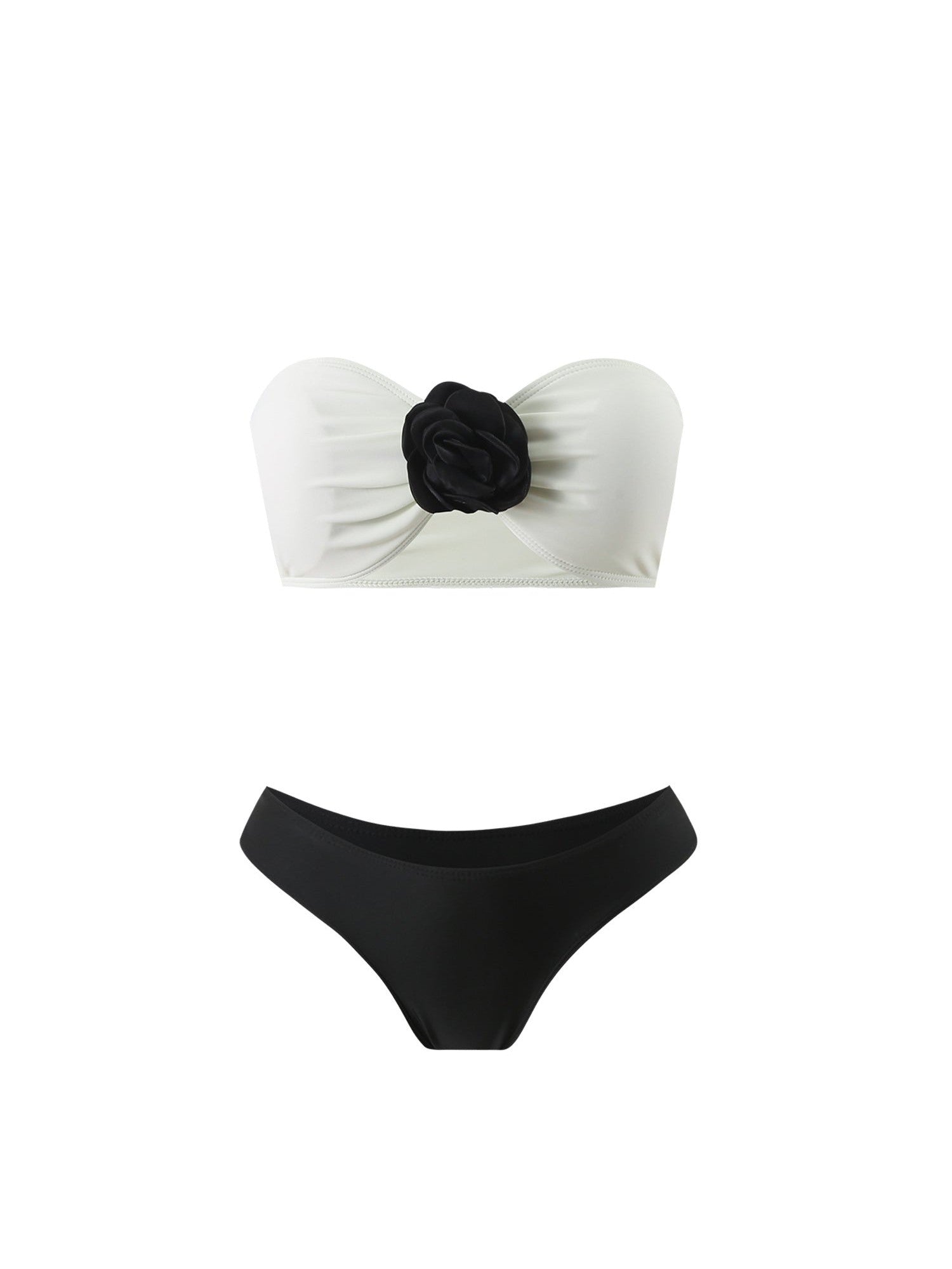 White bandeau bikini top with black rose applique, paired with black bikini bottoms.