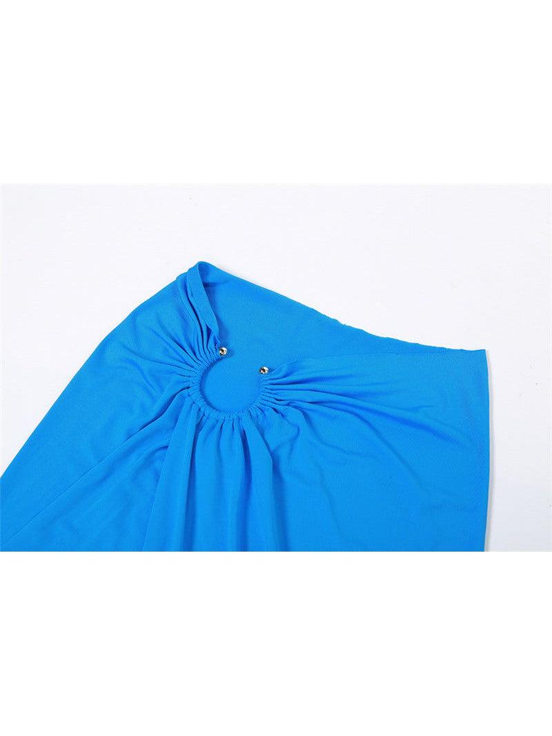 Cobalt blue cropped tank top with a gathered circular ring cutout at the front and two gold-tone studs.