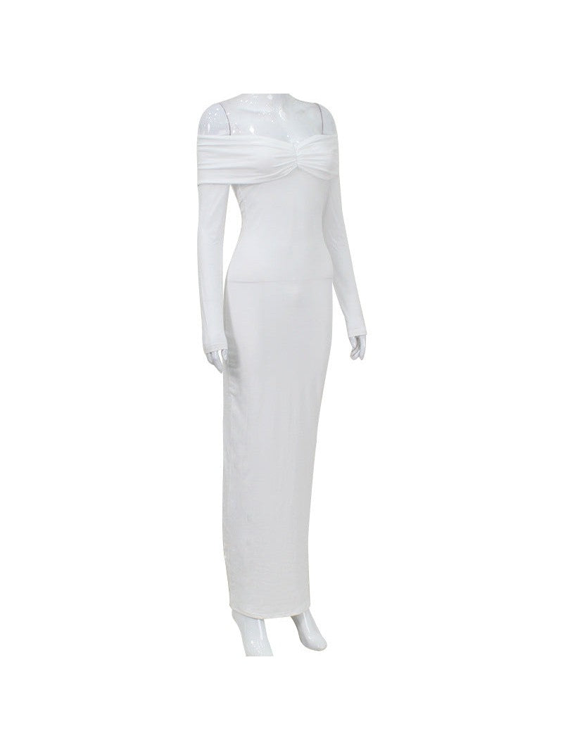 White off-shoulder long-sleeve maxi dress on a mannequin, twisted ruched bust and smooth fitted skirt.