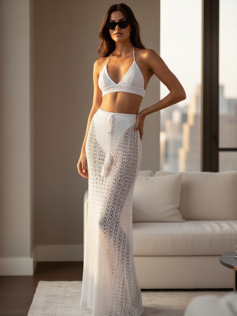 Crochet bikini set with long skirt, white, halter top and tassel-detailed crochet maxi skirt.