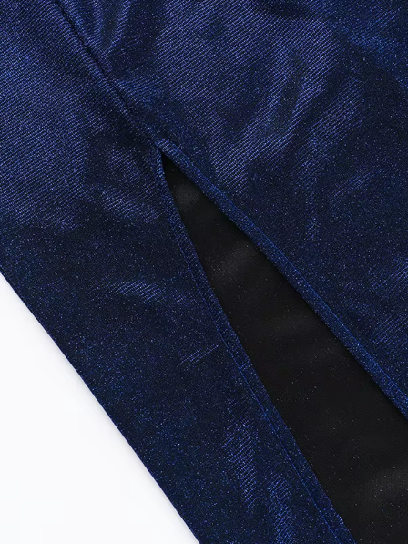 Close-up of navy blue shimmering fabric with a diagonal seam exposing black lining through a slit.