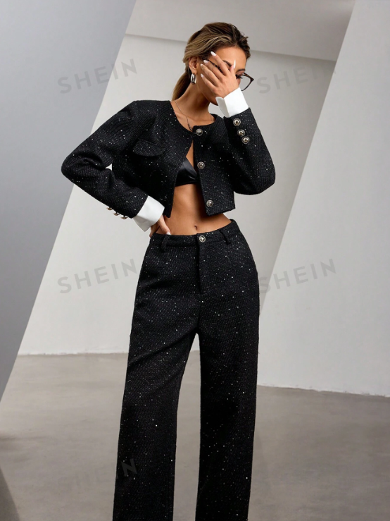 Black tweed sequined cropped jacket with white cuffs and buttons, paired with high-waisted wide-leg sequined pants.