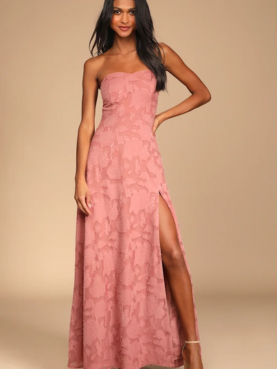 Blush pink strapless sweetheart gown with floral lace overlay, thigh-high slit, floor-length A-line silhouette.