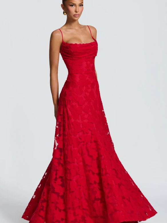 Red floral lace applique maxi dress on a model with thin spaghetti straps and a ruched bodice, flowing A-line skirt.