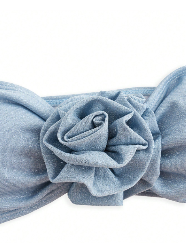 Ice blue bandeau swim top with a large layered fabric rose at the center.
