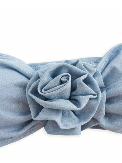 Ice blue bandeau swim top with a large layered fabric rose at the center.