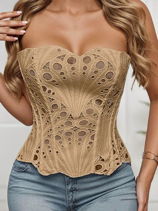 Tan mesh lace tube top with circular cutouts and scalloped edges, strapless corset-style, worn with light-wash jeans.
