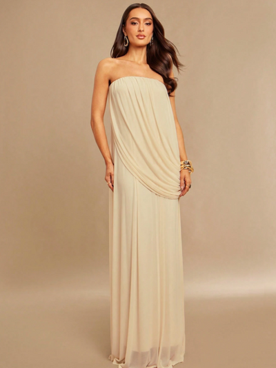 Ivory strapless draped maxi dress on a model, floor-length with soft flowing fabric and gathered front drape
