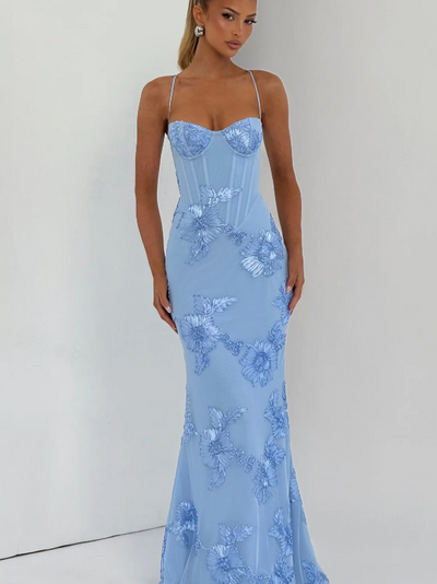 Light blue floral jacquard corset mermaid maxi dress with thin straps and large floral appliques along the skirt.