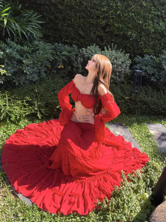 Scarlet Ruffle Off-Shoulder Tiered Maxi Set by Exclusives; red combo set on model in garden