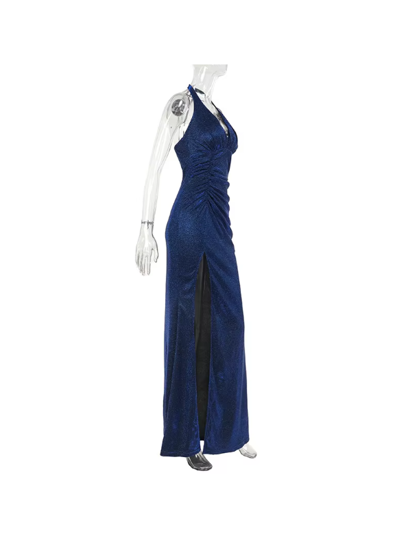 Blue shimmering backless halter-neck maxi dress with ruched bodice and a high slit on a clear mannequin.