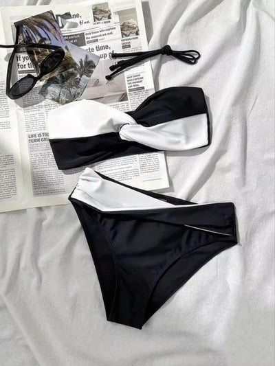 Monochrome Muse Twist Bikini Set by Swimwears; black and white color-block bandeau top with matching bottoms, on sale