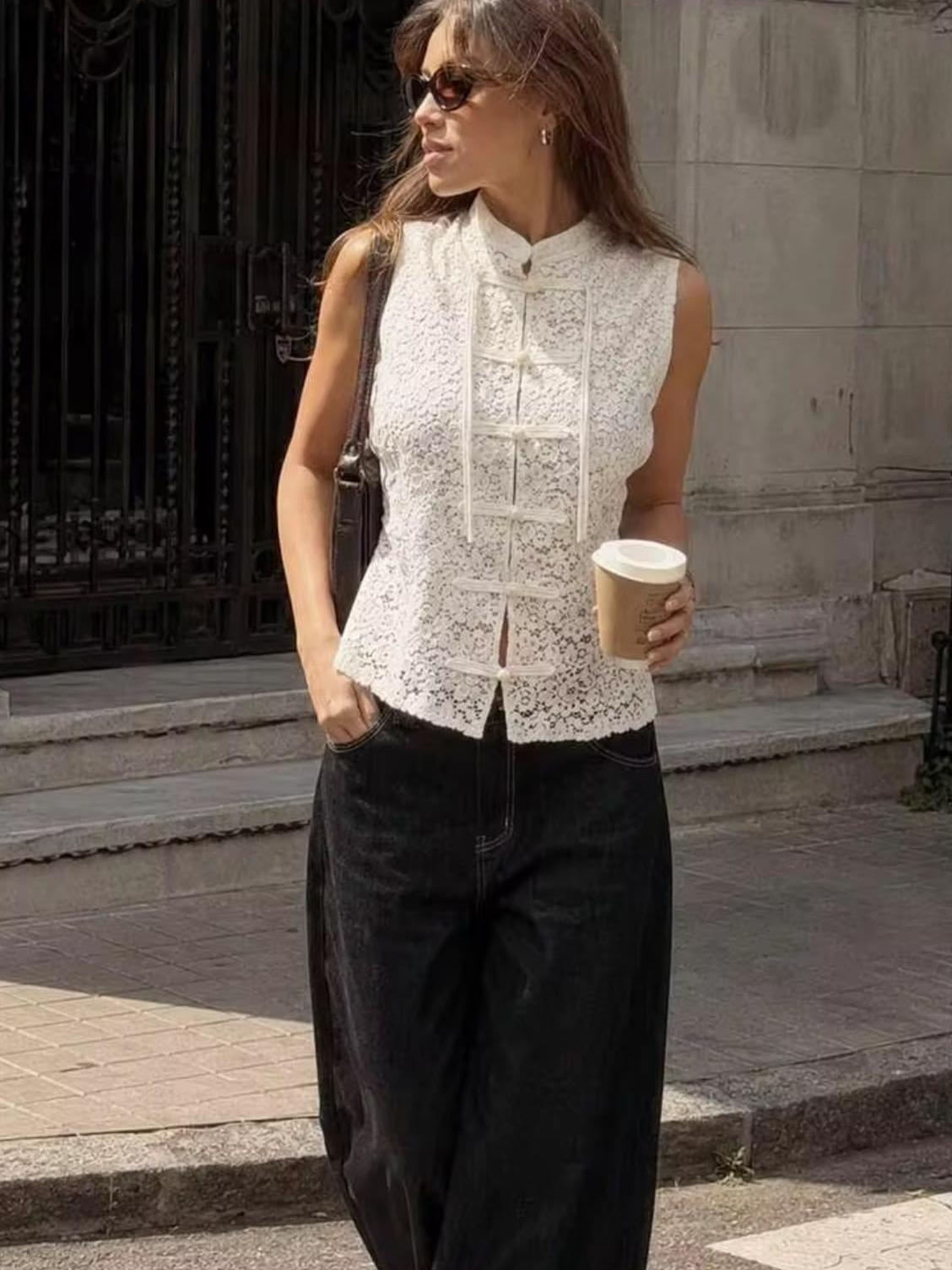 Ivory lace mandarin-top blouse, sleeveless with front frog-closure detailing and scalloped hem
