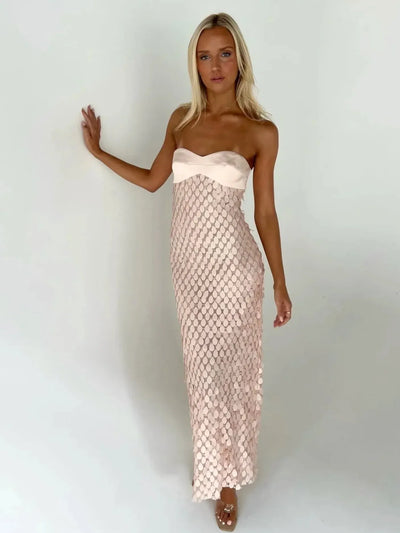 Blush pink strapless tube maxi dress with satin bust and mermaid-scale sequin overlay.