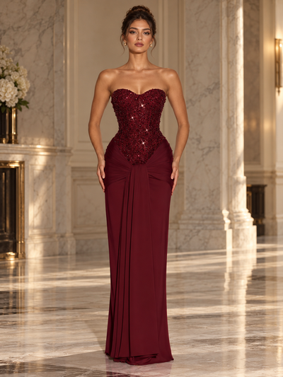 Ophelia Corset Maxi Dress, burgundy strapless gown with sequined corset bodice and draped skirt.