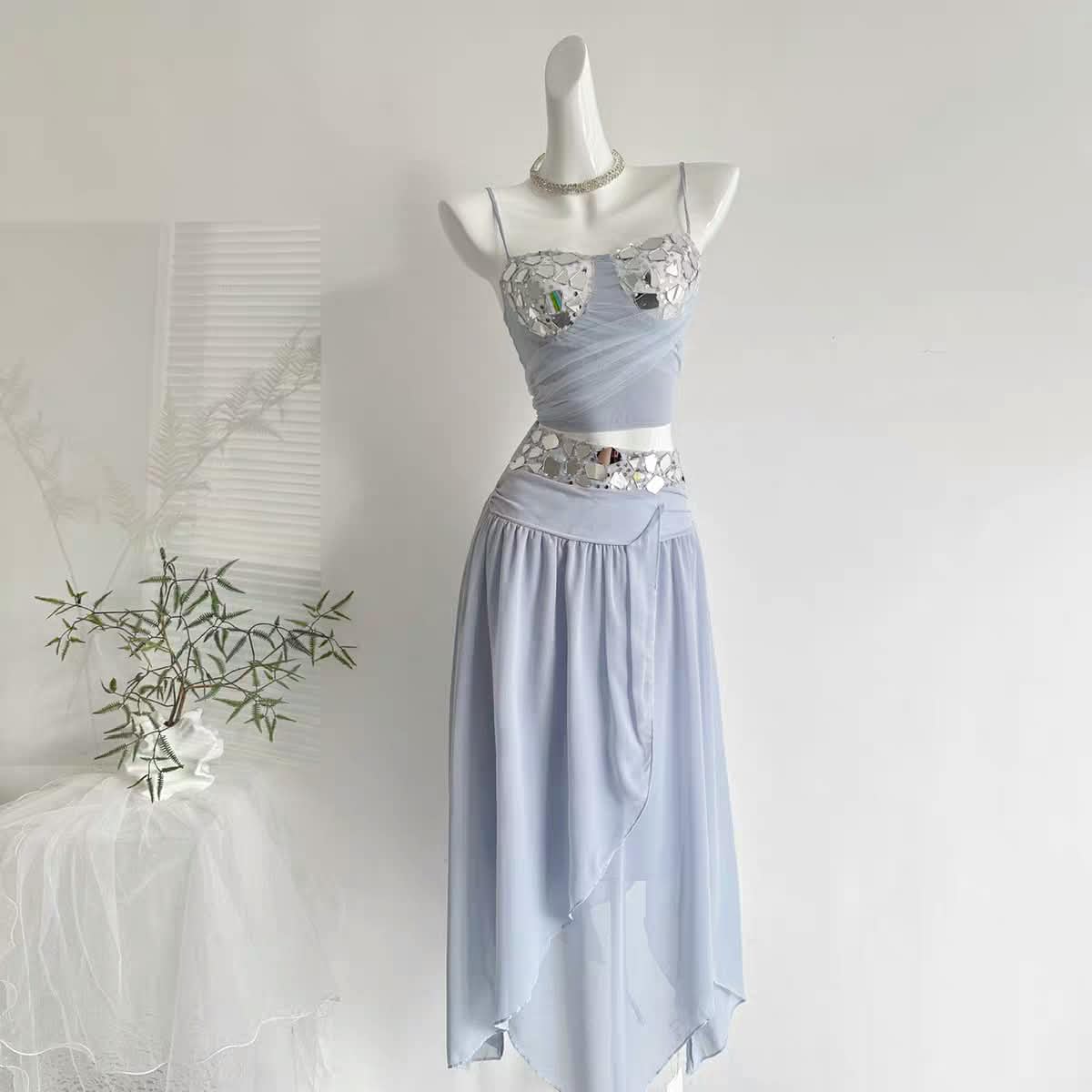 Celestia Mirror Co-ord Set, 2-piece light blue outfit with mirrored sequin bodice and waist band, draped skirt.