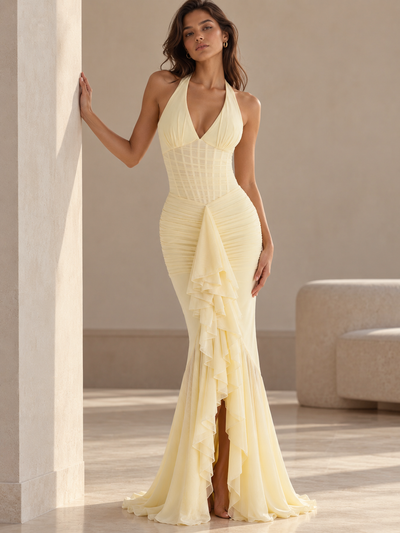 Seraphina Ruched Ruffle Halter Maxi Dress by EXCLUSIVES in pale yellow with ruched bodice and cascading front ruffles.
